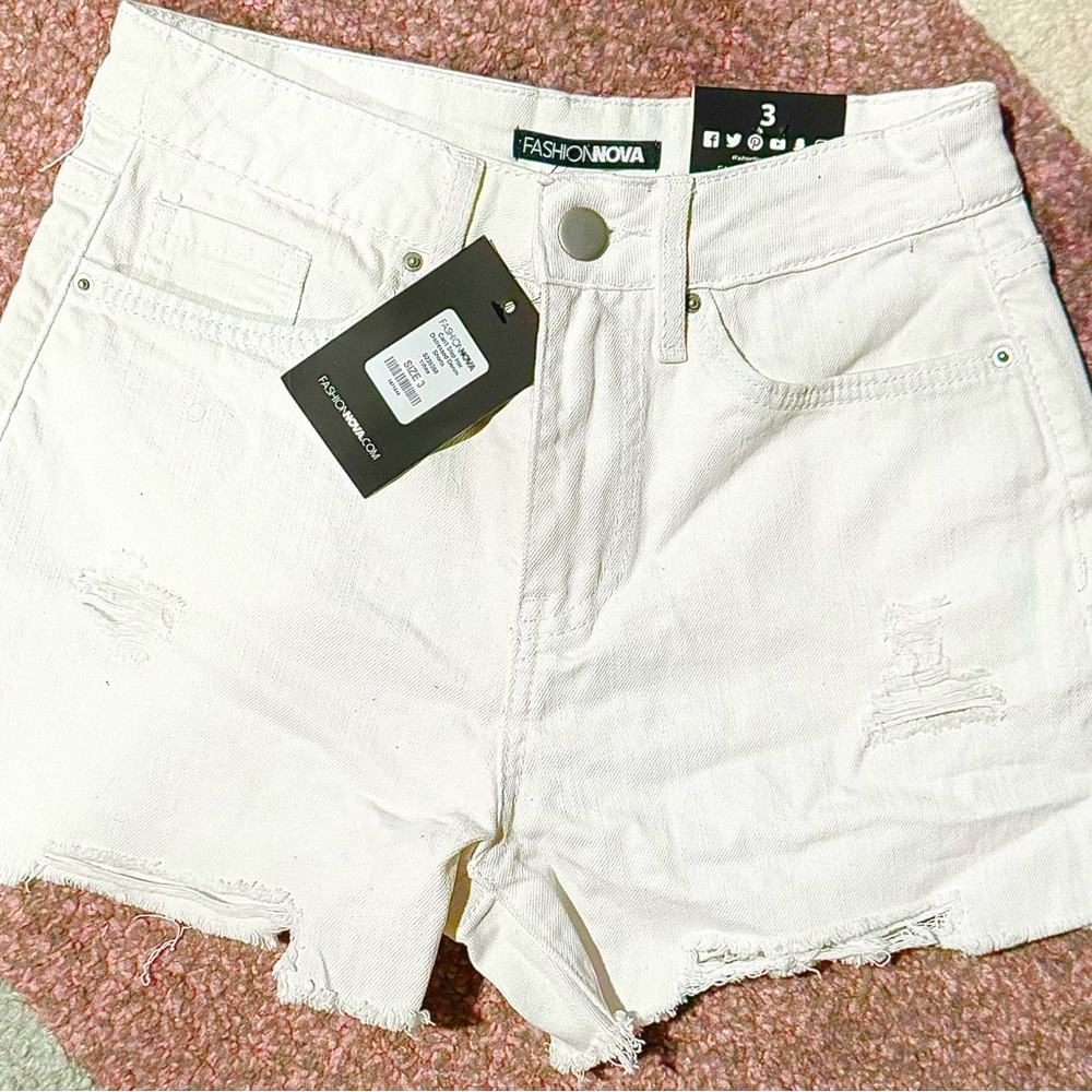 Fashion Nova “Can’t Stop Her Distressed Denim Shorts” - White